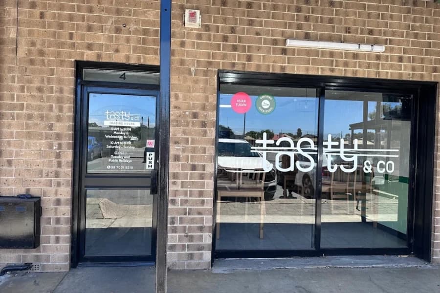 Storefront facade and glass entrance door of Tasty & Co Unit 4